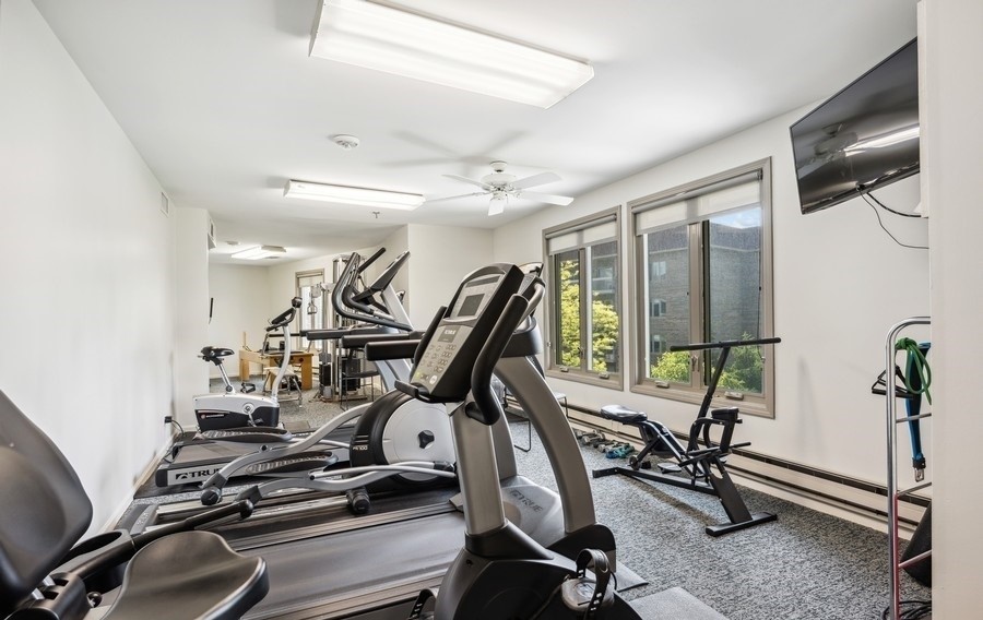1280 Rudolph Drive, Unit 5E Northbrook, IL 60062 - Photo 27 of 33 a view of a room with gym equipment