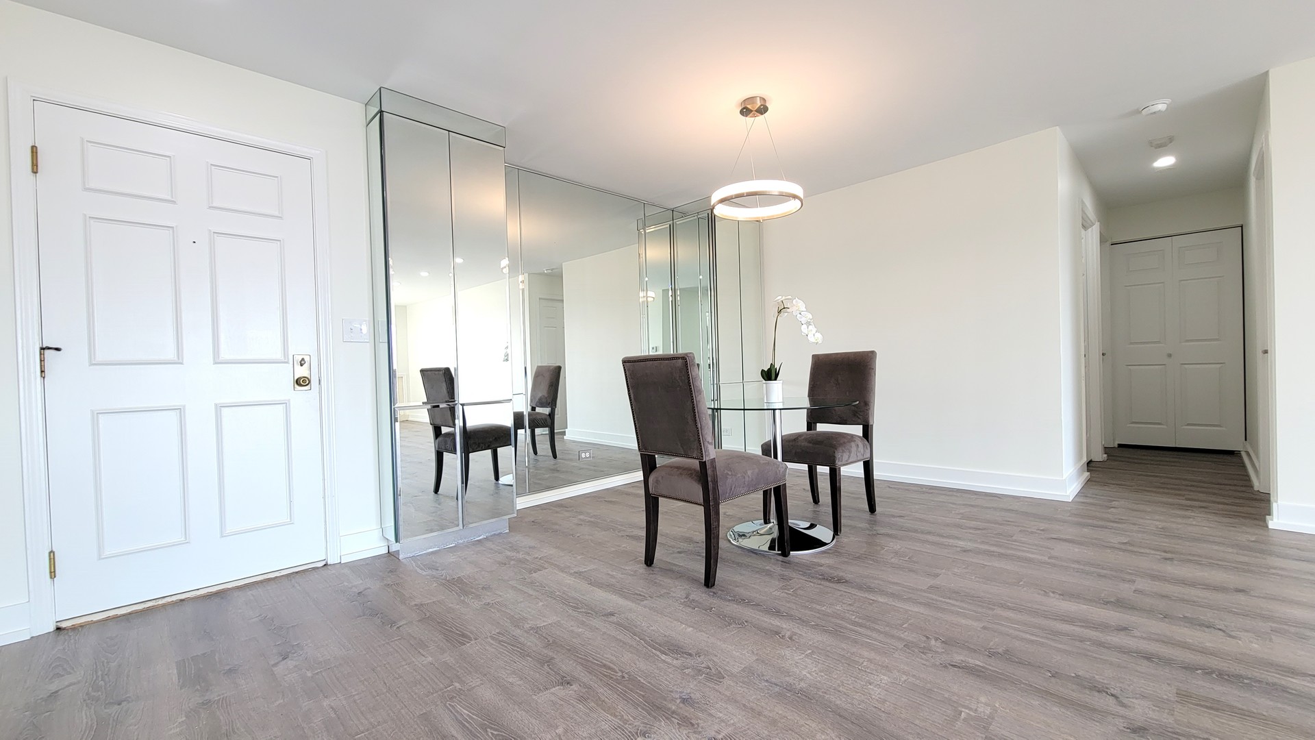 1280 Rudolph Drive, Unit 5E Northbrook, IL 60062 - Photo 3 of 33 a view of a dining room with furniture and wooden floor