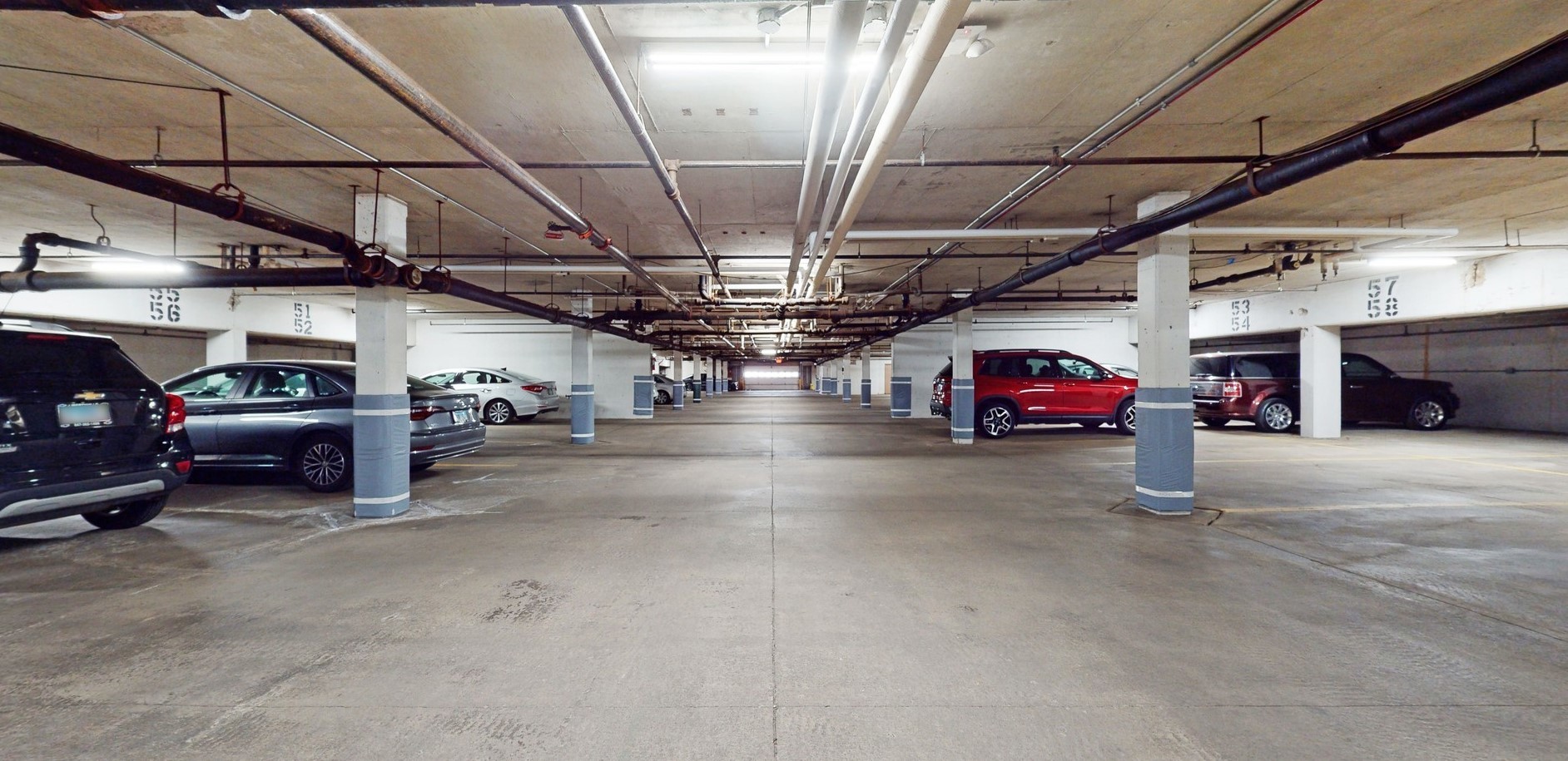 1280 Rudolph Drive, Unit 5E Northbrook, IL 60062 - Photo 31 of 33 a view of parking garage with cars