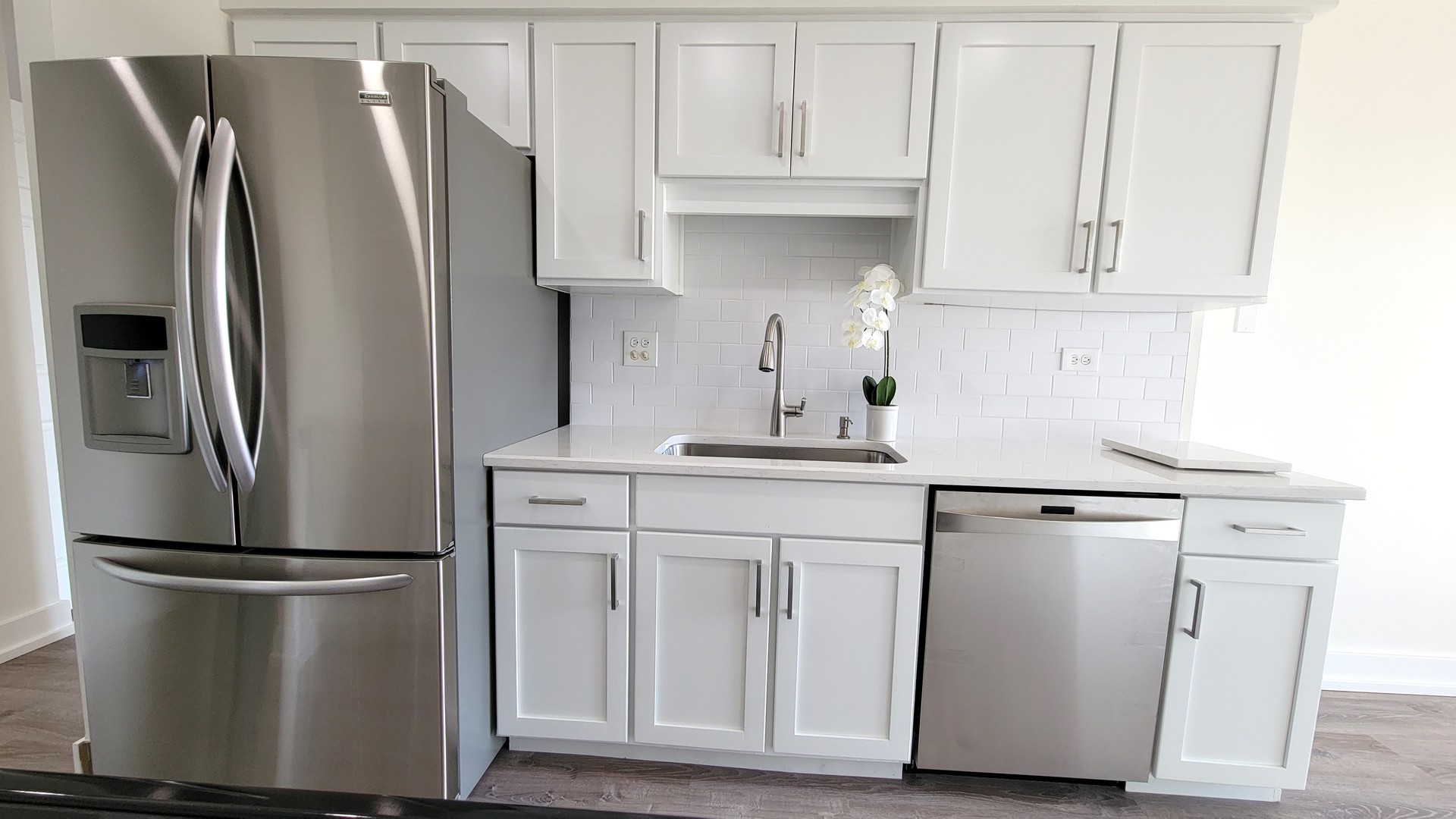 1280 Rudolph Drive, Unit 5E Northbrook, IL 60062 - Photo 6 of 33 a kitchen with white cabinets and stainless steel appliances