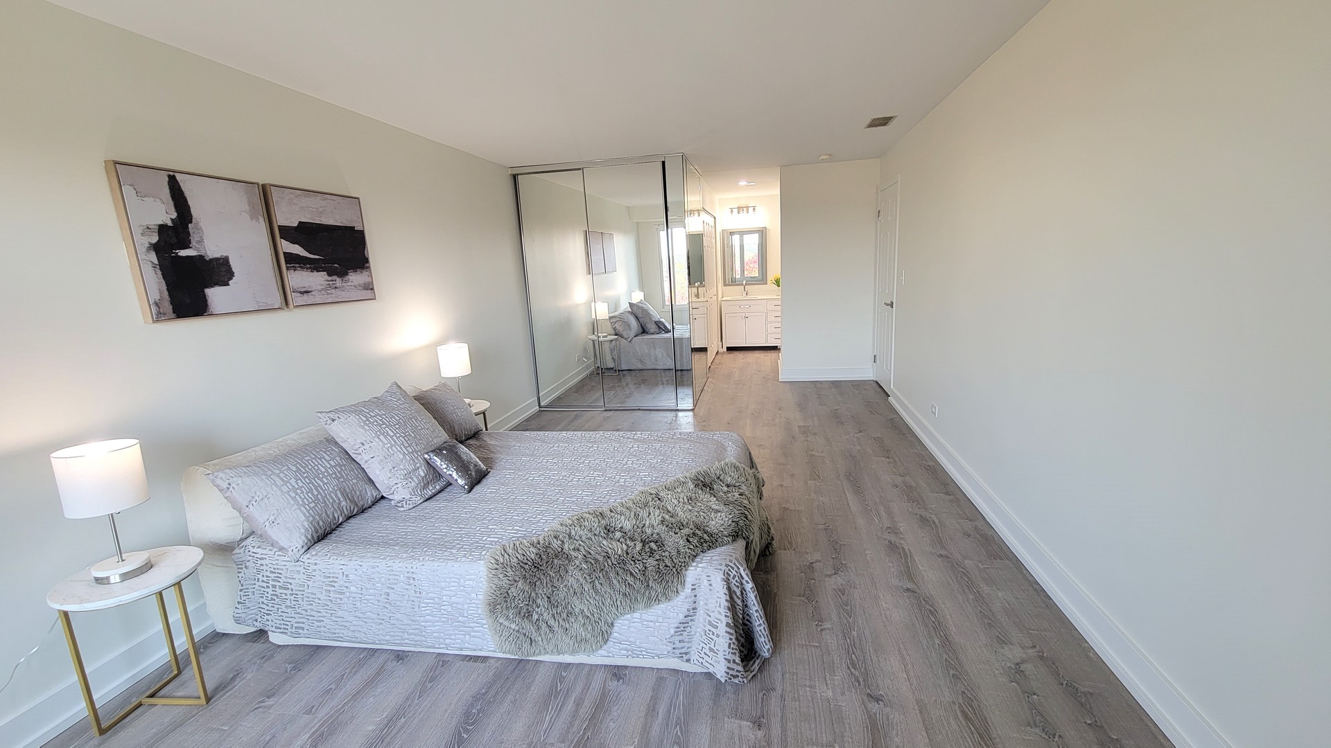 1280 Rudolph Drive, Unit 5E Northbrook, IL 60062 - Photo 9 of 33 a spacious bedroom with a bed and a couch