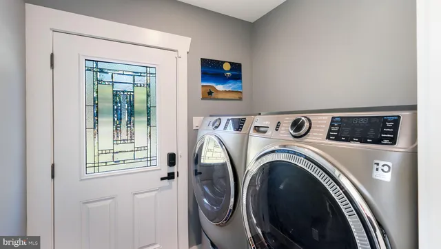 a utility room with dryer and washer