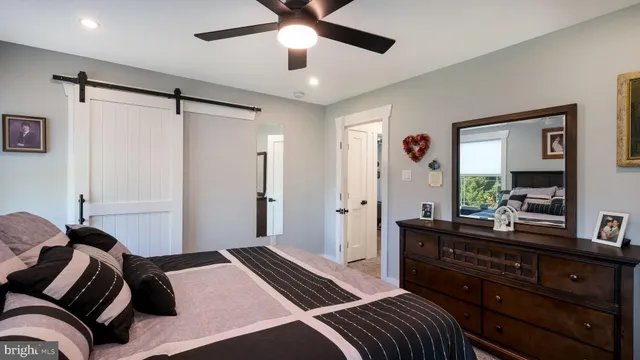 a bedroom with a bed and a dresser