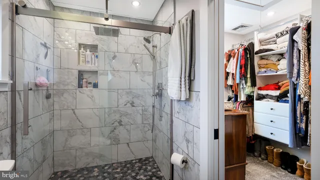 a bathroom with a shower and a sink