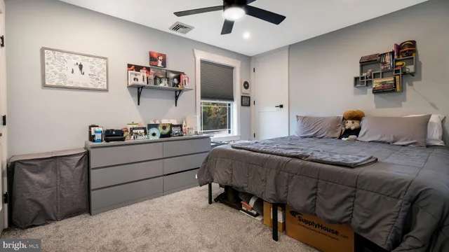 a bedroom with a bed and cabinets