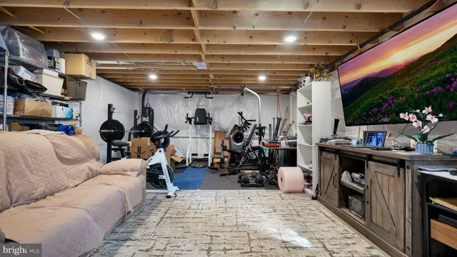 a living room with lots of furniture and a fireplace