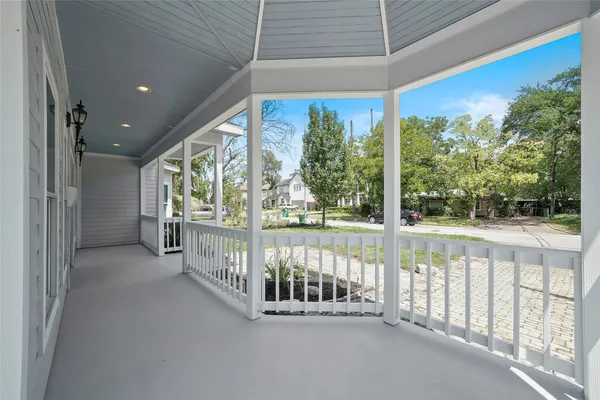 a view of a porch with wooden floor and roof