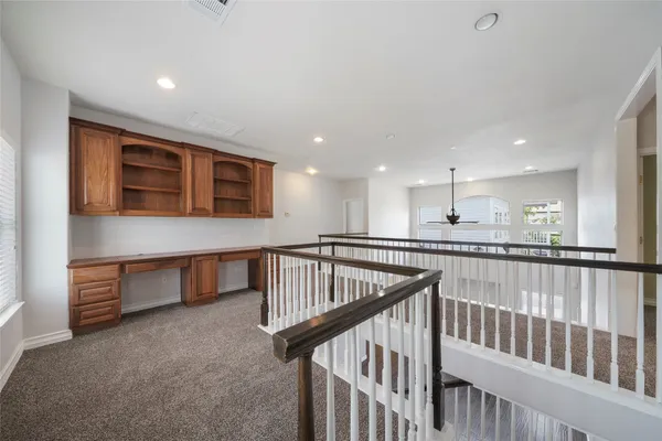 a view of staircase with lots of wooden floor