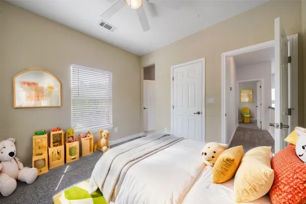 a bedroom with bed and a lamp
