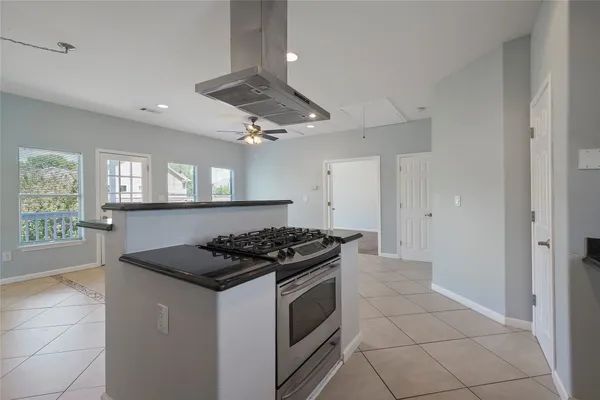 a kitchen with stainless steel appliances granite countertop a stove and a sink