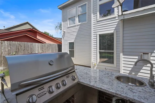 a view of a kitchen with a sink and dishwasher