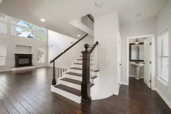 a view of entryway with wooden floor and stair