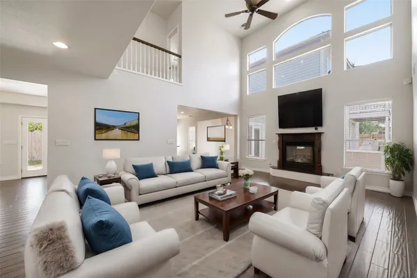 a living room with furniture fireplace and a flat screen tv