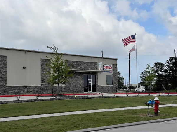 a view of building with outdoor space and seating