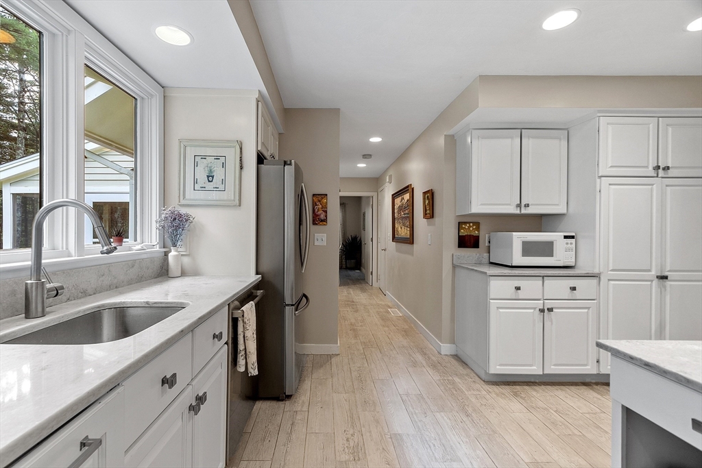 72 Finn Road Harvard, MA 01451 - Photo 13 of 40 a kitchen with white cabinets and stainless steel appliances