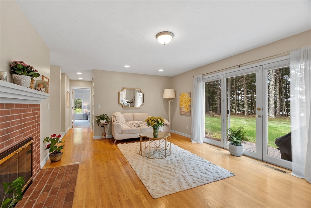 72 Finn Road Harvard, MA 01451 - Photo 17 of 40 a living room with furniture floor to ceiling window and wooden floor