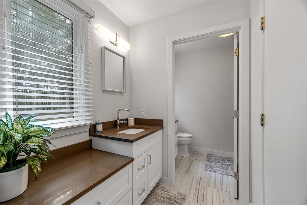 72 Finn Road Harvard, MA 01451 - Photo 19 of 40 a bathroom with a sink a toilet and a mirror