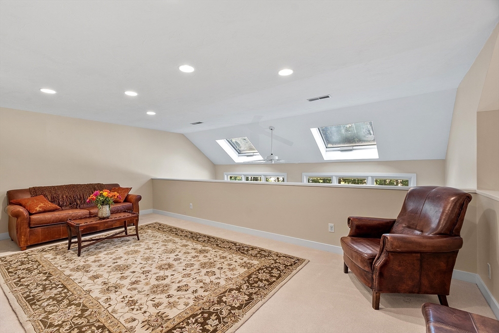 72 Finn Road Harvard, MA 01451 - Photo 21 of 40 a living room with furniture and a rug