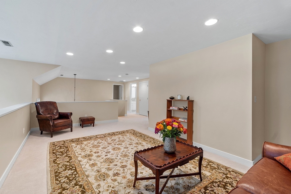 72 Finn Road Harvard, MA 01451 - Photo 22 of 40 a living room with furniture and a potted plant