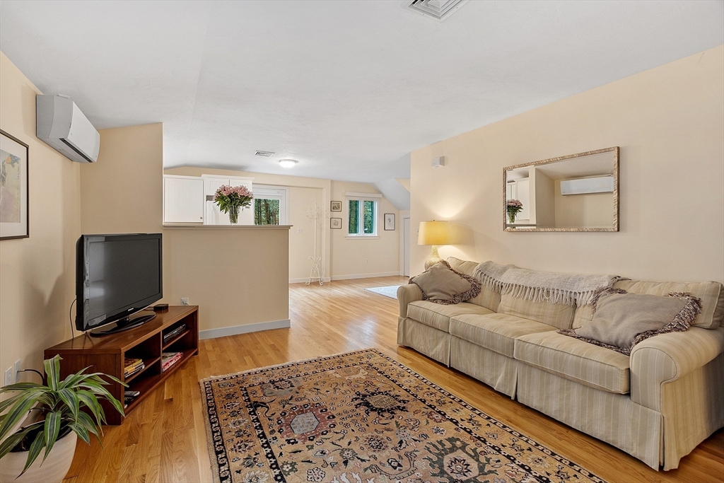 72 Finn Road Harvard, MA 01451 - Photo 28 of 40 a living room with furniture and a flat screen tv