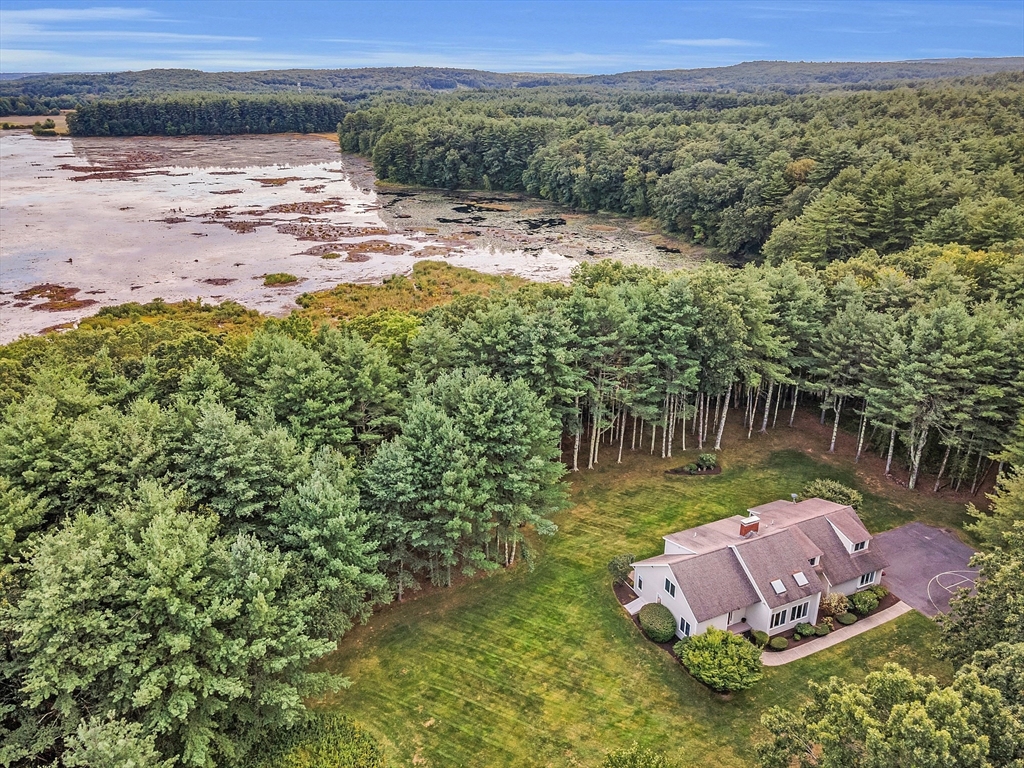 72 Finn Road Harvard, MA 01451 - Photo 39 of 40 a view of a backyard with plants and lake