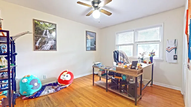 a bedroom with furniture and a window