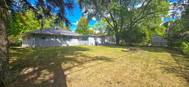a house with swimming pool in front of it