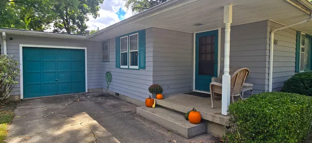 a backyard of a house with seating space