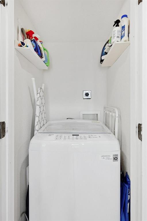 2722 Knight Street, Unit 232A Dallas, TX 75219 - Photo 14 of 24 a utility room with dryer and washer