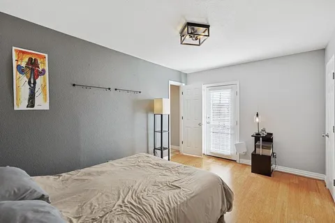 a bedroom with a bed and a cabinets