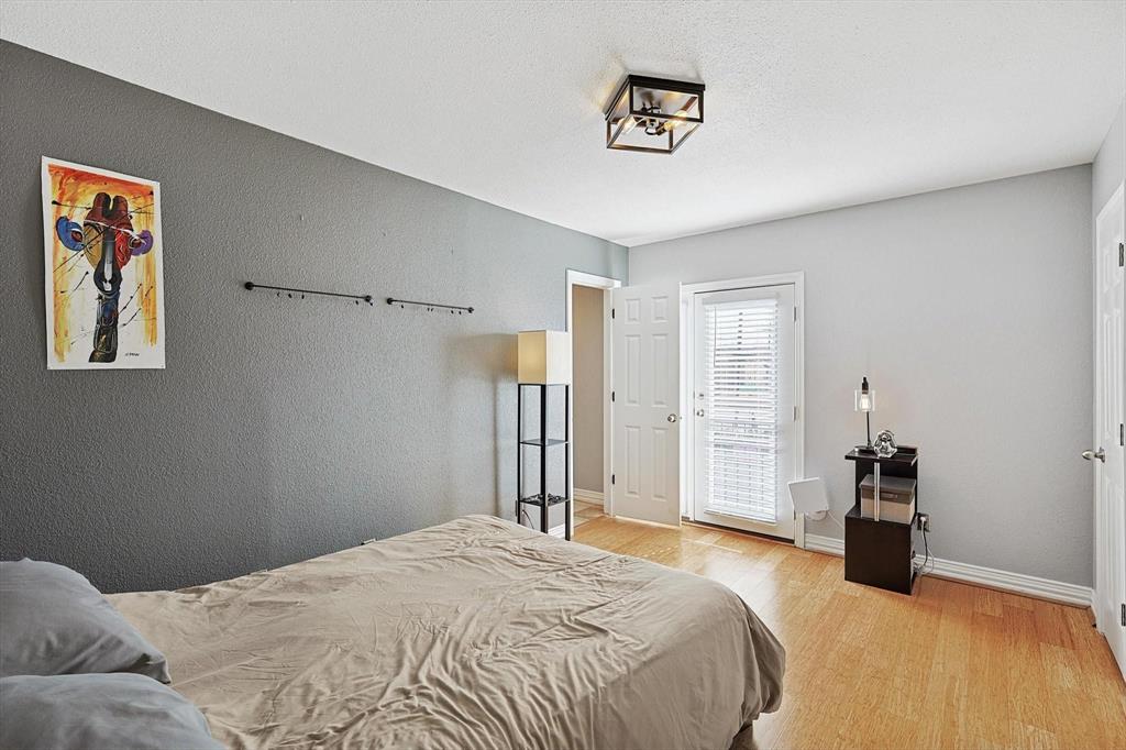 2722 Knight Street, Unit 232A Dallas, TX 75219 - Photo 15 of 24 a bedroom with a bed and a cabinets