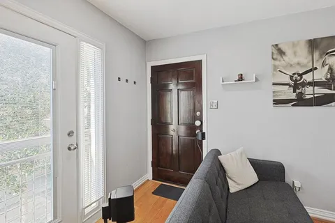 a bedroom with furniture and a window