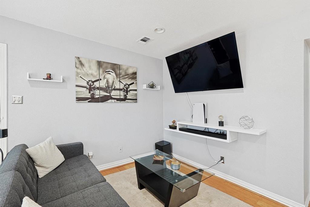 2722 Knight Street, Unit 232A Dallas, TX 75219 - Photo 5 of 24 a living room with furniture and a flat screen tv