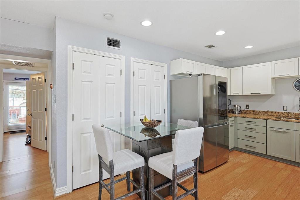2722 Knight Street, Unit 232A Dallas, TX 75219 - Photo 8 of 24 a dining room with furniture and wooden floor