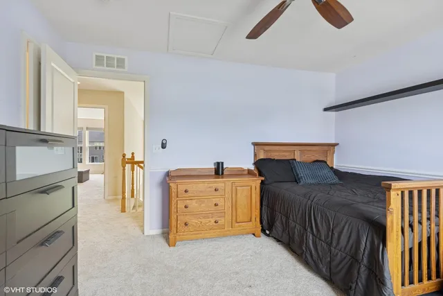a bedroom with furniture and wooden floor
