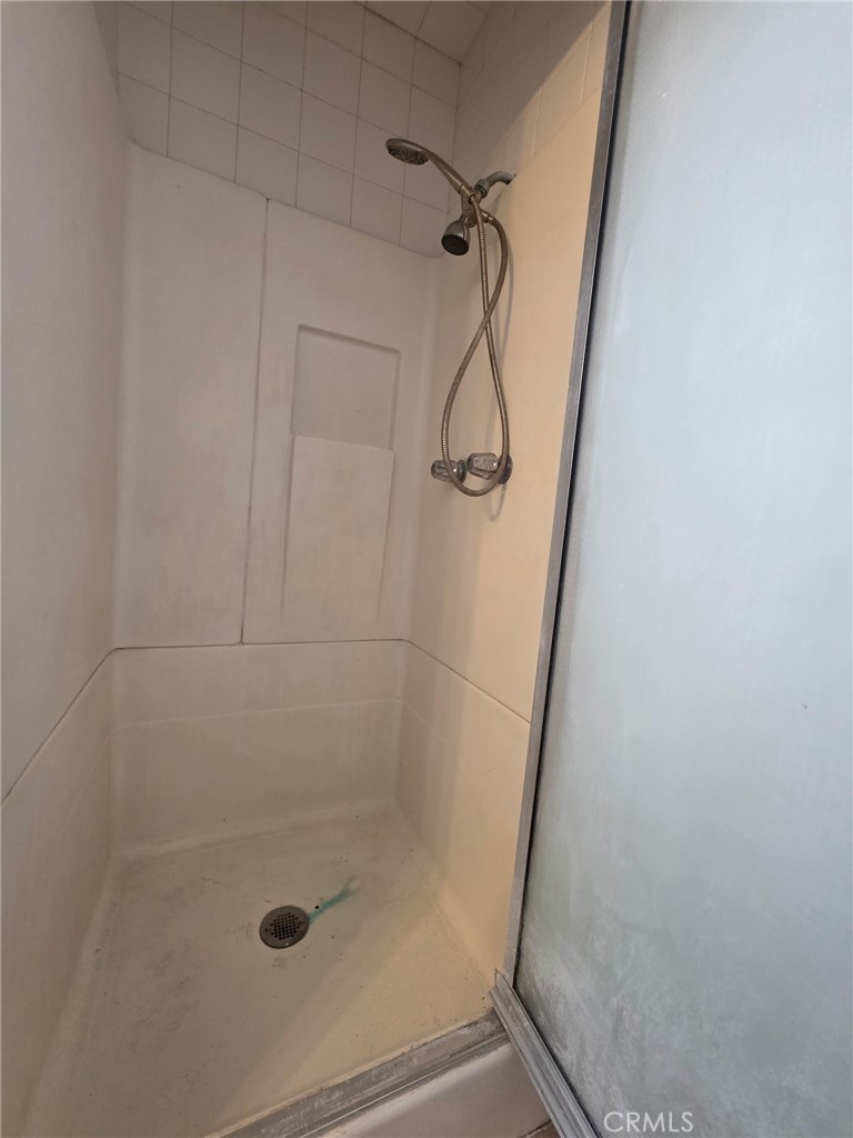220 South Pannes Avenue, Unit 1 Compton, CA 90221 - Photo 12 of 15 a bathroom with a glass door shower