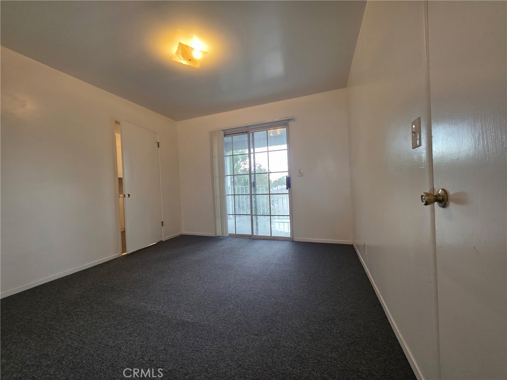 220 South Pannes Avenue, Unit 1 Compton, CA 90221 - Photo 6 of 15 an empty room with windows