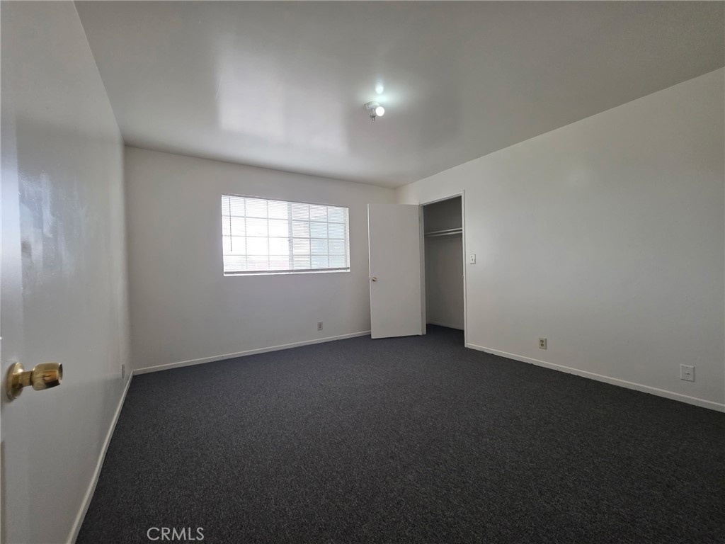 220 South Pannes Avenue, Unit 1 Compton, CA 90221 - Photo 7 of 15 an empty room with a window