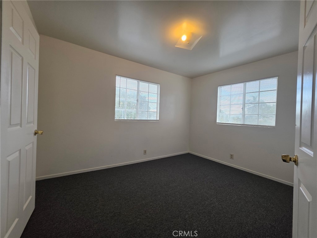 220 South Pannes Avenue, Unit 1 Compton, CA 90221 - Photo 8 of 15 an empty room with windows