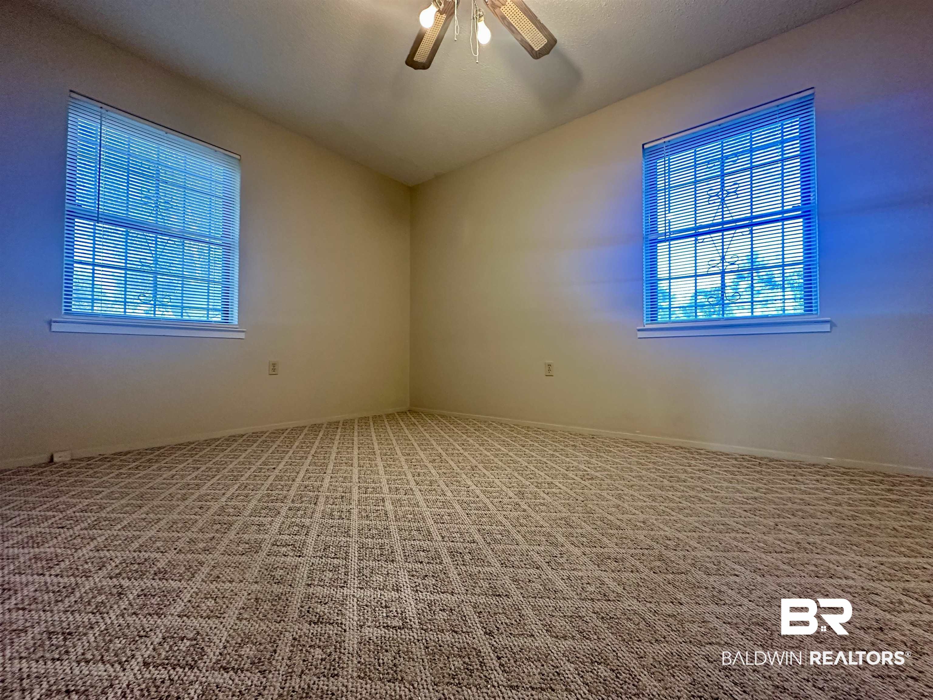 3451 Kirkland Road Brewton, AL 36426 - Photo 15 of 17 Carpeted spare room featuring ceiling fan and lofted ceiling