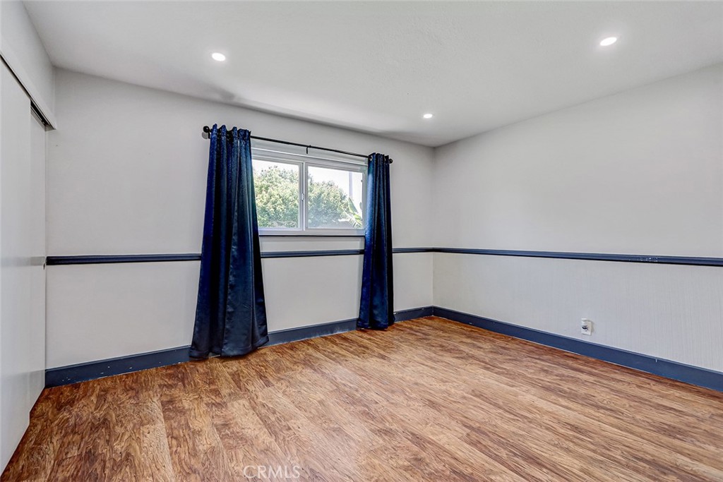 15232 Purdy Street Westminster, CA 92683 - Photo 19 of 31 a view of empty room with wooden floor and fan