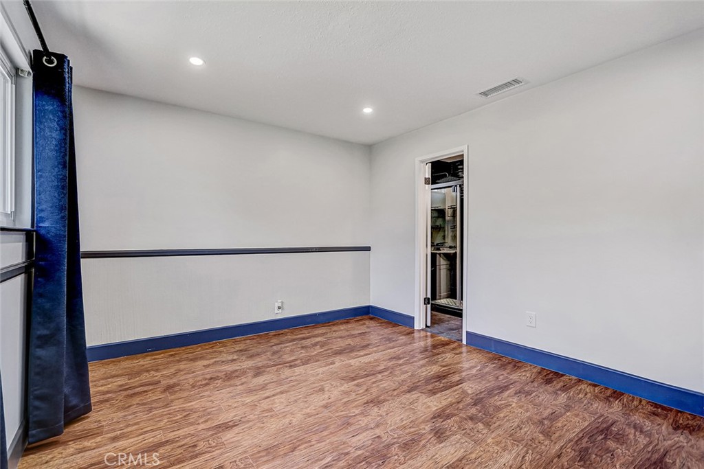 15232 Purdy Street Westminster, CA 92683 - Photo 20 of 31 a view of empty room with wooden floor