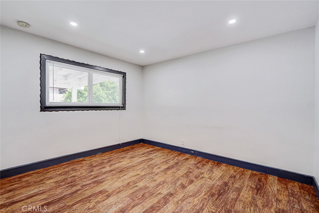15232 Purdy Street Westminster, CA 92683 - Photo 22 of 31 a view of room with wooden floor and window