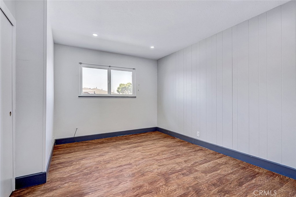 15232 Purdy Street Westminster, CA 92683 - Photo 24 of 31 an empty room with wooden floor and windows