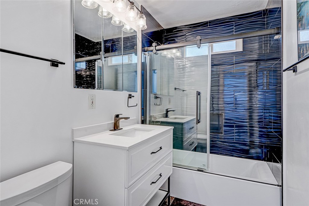 15232 Purdy Street Westminster, CA 92683 - Photo 5 of 31 a bathroom with a sink a toilet and shower