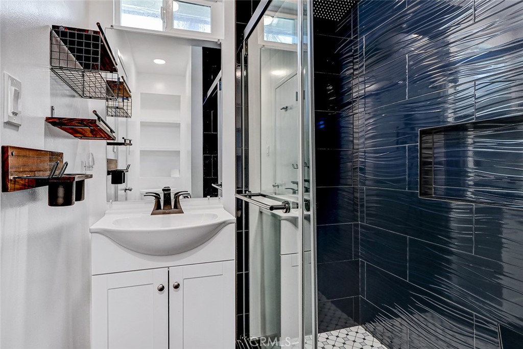 15232 Purdy Street Westminster, CA 92683 - Photo 6 of 31 a bathroom with a sink and a mirror