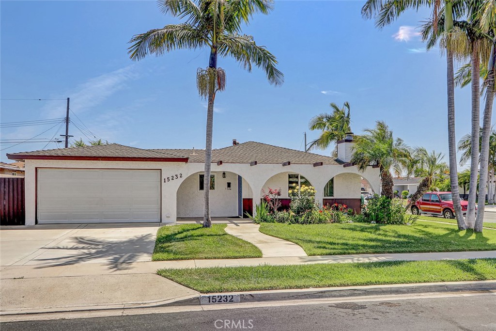 15232 Purdy Street Westminster, CA 92683 - Photo 7 of 31 a front view of a house with a garden and yard