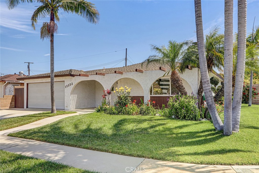 15232 Purdy Street Westminster, CA 92683 - Photo 9 of 31 a front view of a house with a garden