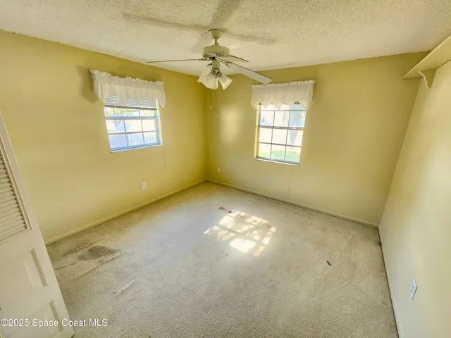 a view of a room with closet and wooden floor