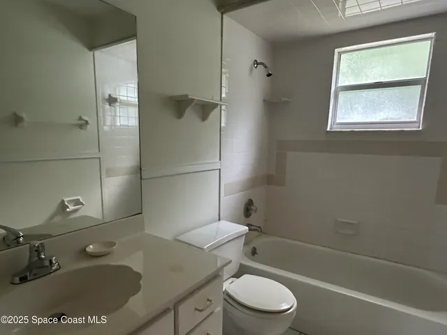 a view of a big room with closet and wooden floor